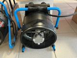 a black blower sitting next to a blue blower on a tile floor