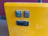 a yellow box with two green and red buttons