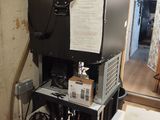 an image of a room with a refrigerator and a tv