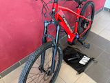 a bike that is sitting on a stand in a room