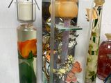 many different types of glass vases on the table