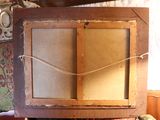a picture of an old wooden cabinet with a glass door