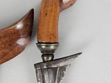 pair of wooden handles and a knife on a white surface