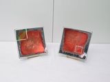 pair of red and green glass cufflinks with a square design