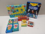 several children ' s board games are sitting on a white table