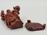 a small figurine of a man riding a horse