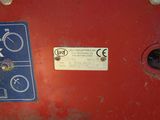 a close up of a sign on the side of a red vehicle