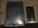 a cell phone sitting on top of a table next to a cell phone