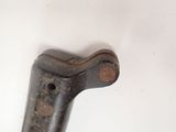 an old metal object that is on a white surface