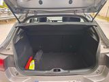 a trunk of a silver car with its trunk open