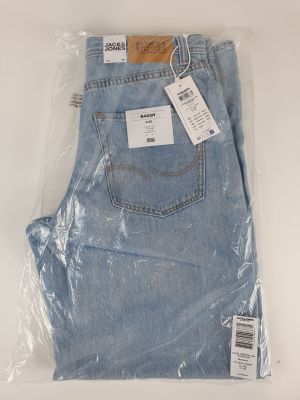 the back of a pair of light blue jeans wrapped in plastic