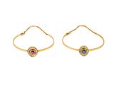 une paire de bracelets en or sertis de pierres bleues et roses