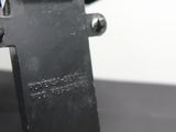 a metal object that looks like a gun on a table