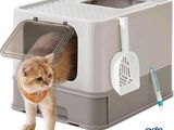 a cat that is standing in a litter box