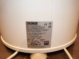 a close up of a hot water heater on a table