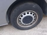 a close up of a tire on a car ' s rim