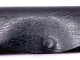 black leather business card case on a white background