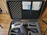 a black case with tools inside of it on the floor