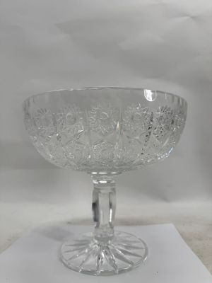 a glass bowl sitting on top of a piece of paper