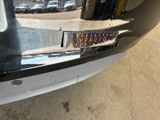 a sticker on the bumper of a car that has a sticker on it