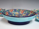 a blue bowl with a blue rim and a blue bowl with a blue rim and a blue bowl with a blue rim and a blue bowl with a blue