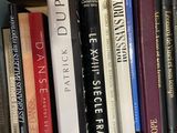 many books that are on a shelf in a box