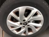 the tire of a car with a hole in the center of the tire