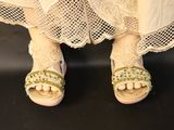 a close up picture of a woman ' s feet wearing sandals