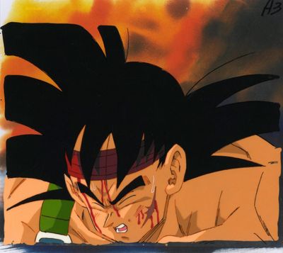 un gros plan sur un tableau représentant un jeune Gohan avec du sang sur le visage