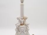 an image of a white lamp with two chers on top of it