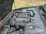a picture of a car engine with its hood open