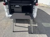 a small table in the back of a van