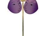 pair of purple face earrings on a gold stand on a white background