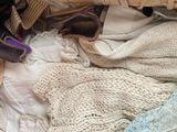 a basket full of clothes and a pair of shoes