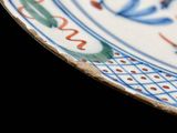 a close up of a plate with a design on it