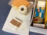 a box with a book, tape, and other items on it