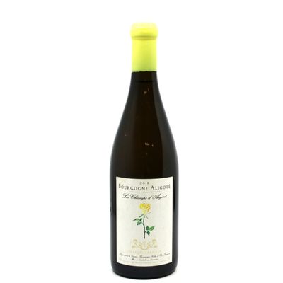 a bottle of wine that is sitting on a table