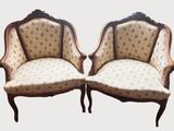 pair of antique french style chairs with floral upholstered upholstered cushions