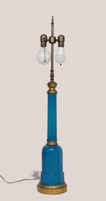 a blue lamp that has two lights on top of it