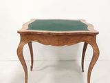 an image of a wooden table with a green glass top