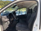 the interior of a white van with the door open