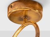 a close up of a light fixture on a white wall