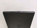 the back of a laptop computer sitting on top of a white surface