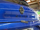 a close up of a blue car with the word clio on it
