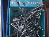 two bins with a bunch of nails in them