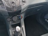 a car dashboard with a steering wheel and a control panel