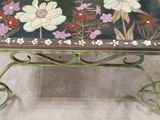 a small table with a floral design on it