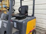a fork lift truck parked in front of a building