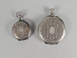 pair of antique silver pocket watches on a white background