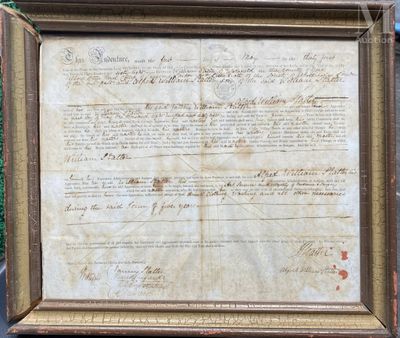 an old document with writing on it in a wooden frame